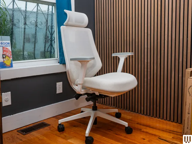 Image may contain: indoor, interior design, chair, furniture, wood paneling, wood, office and office chair