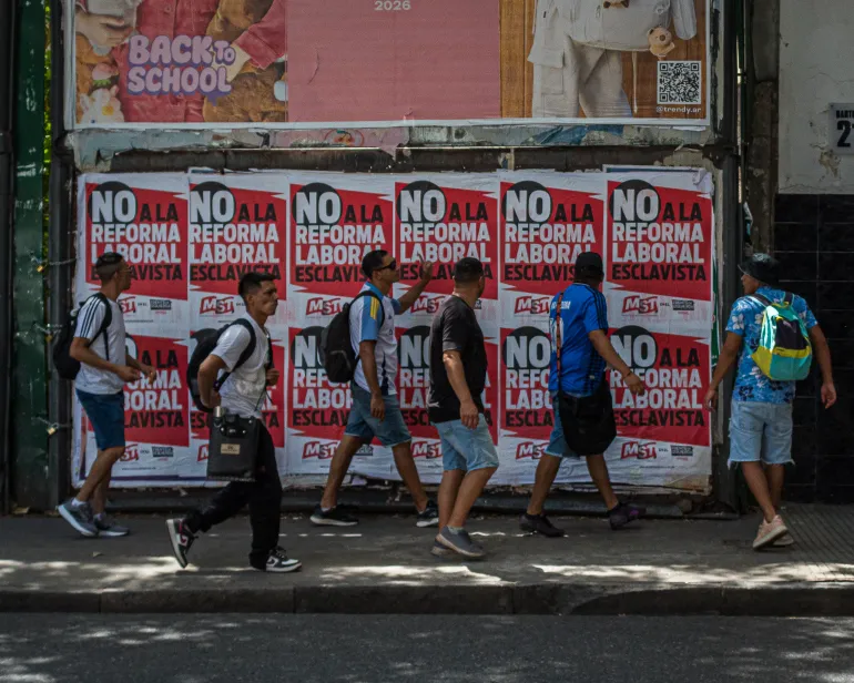 Young people march against the labor reform bill by displaying posters denouncing the legislation