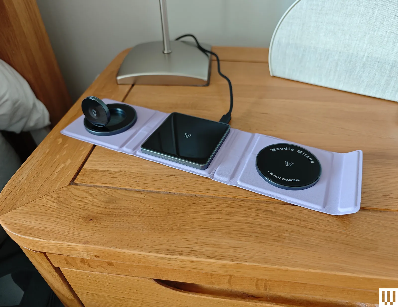 Top view of Milano Milano Foldie a small unfolded purple pad with 3 sections to charge devices wirelessly