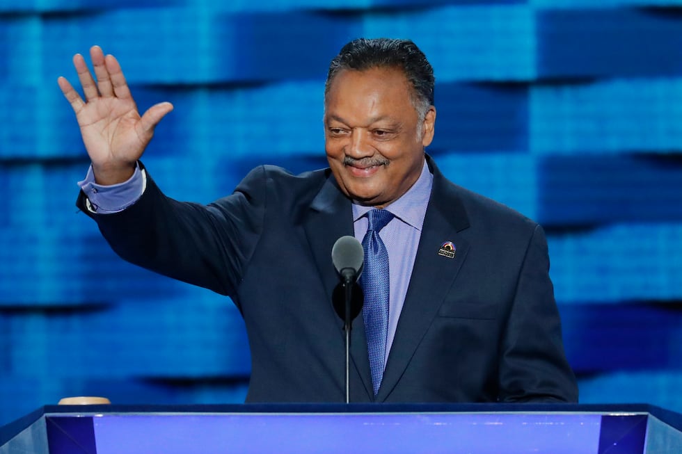 FILE - The Rev. Jesse Jackson waves as he walks to the podium during the third day of the...