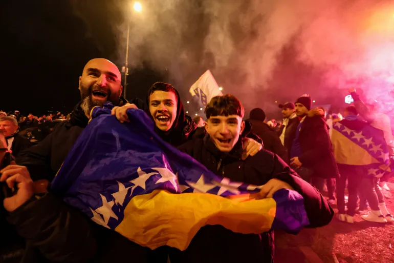 Bosnian fans celebrate after Bosnia and Herzegovina beat Italy on penalties in a FIFA World Cup 2026 European play-off final, in Zenica, Bosnia and Herzegovina, April 1, 2026. REUTERS/Amel Emric