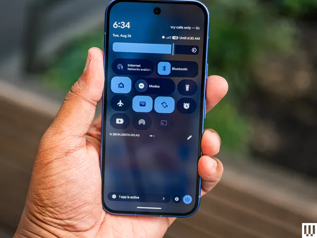 Image may contain: electronics, cellphone, phone and person