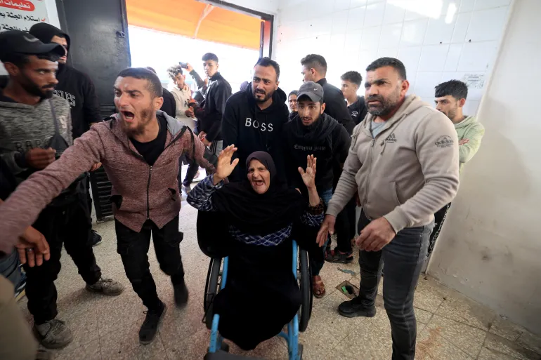 Family members arrive at the Al-Aqsa Martyrs Hospital in Deir al-Balah, where victims were brought after an Israeli attack on the Al-Maghazi refugee camp in the central Gaza Strip on April 6, 2026.
