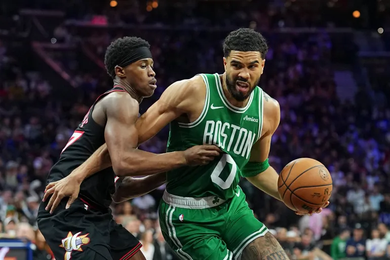 PHILADELPHIA, PENNSYLVANIA - APRIL 24: Jayson Tatum #0 of the Boston Celtics dribbles the ball against Vj Edgecombe #77 of the Philadelphia 76ers in the third quarter during game three of the Eastern Conference first round playoffs at Xfinity Mobile Arena on April 24, 2026 in Philadelphia, Pennsylvania. The Celtics defeated the 76ers 108-100. NOTE TO USER: User expressly acknowledges and agrees that by downloading and or using this photo, User agrees to the terms and conditions of the Getty Images License Agreement. Mitchell Leff/Getty Images/AFP (Photo by Mitchell Leff / GETTY IMAGES NORTH AMERICA / Getty Images via AFP)