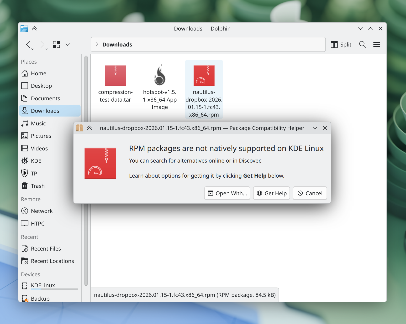 A dialog informs the user that RPM packages are not supported on KDE Linux, and suggests alternative actions