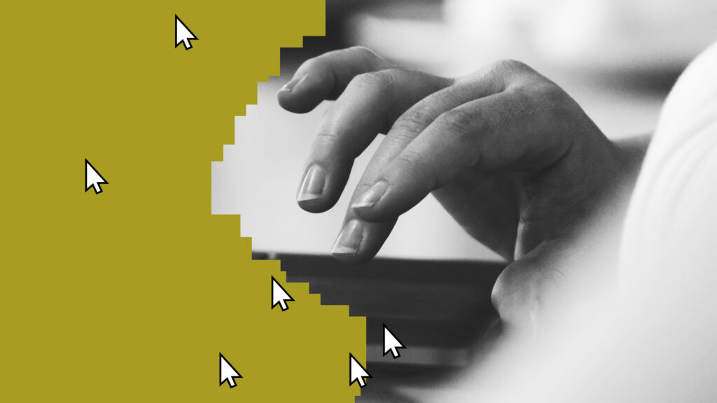 Black and white close-up of a hand with a device next to large pointer icons.