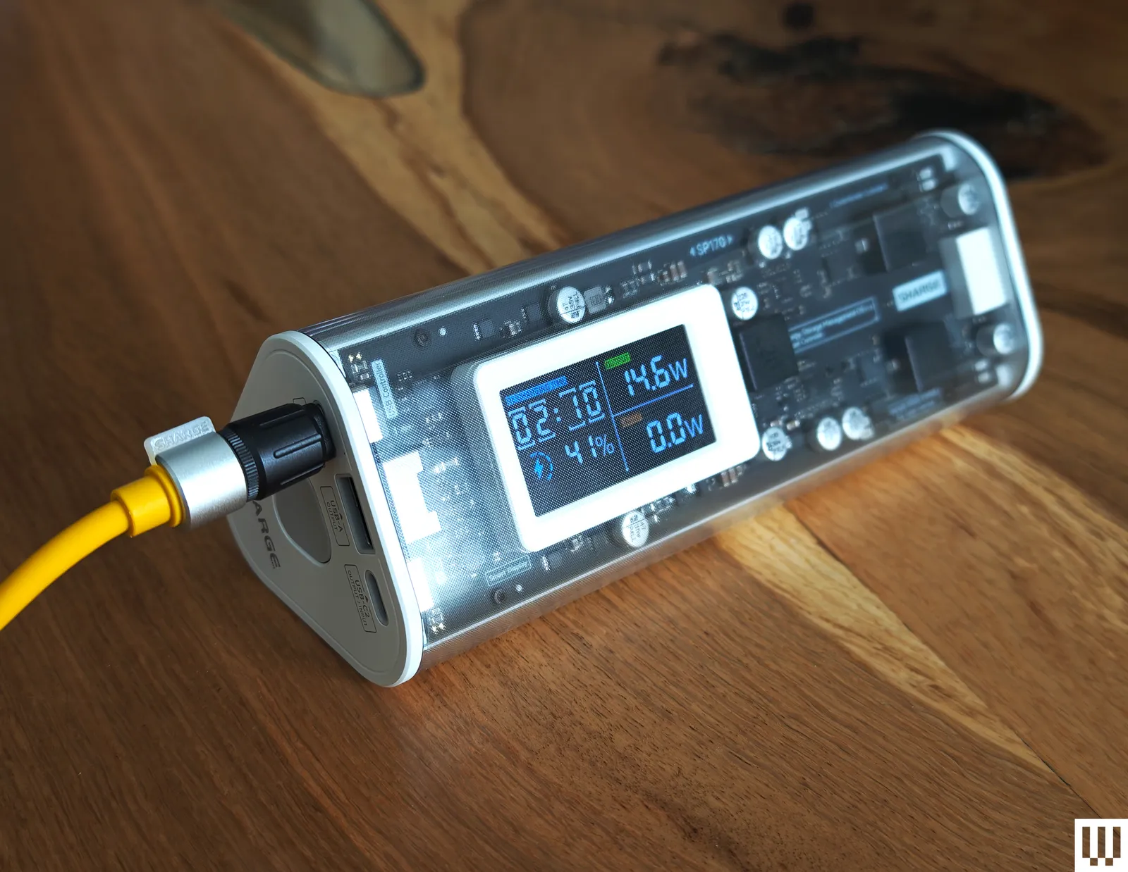 The Shargeek 170 is a long tubular device with a clear case that shows the internals and an external face...