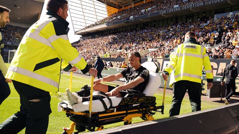 Xavi Simons leaves on a stretcher after picking up an injury for Spurs in their win against Wolves
